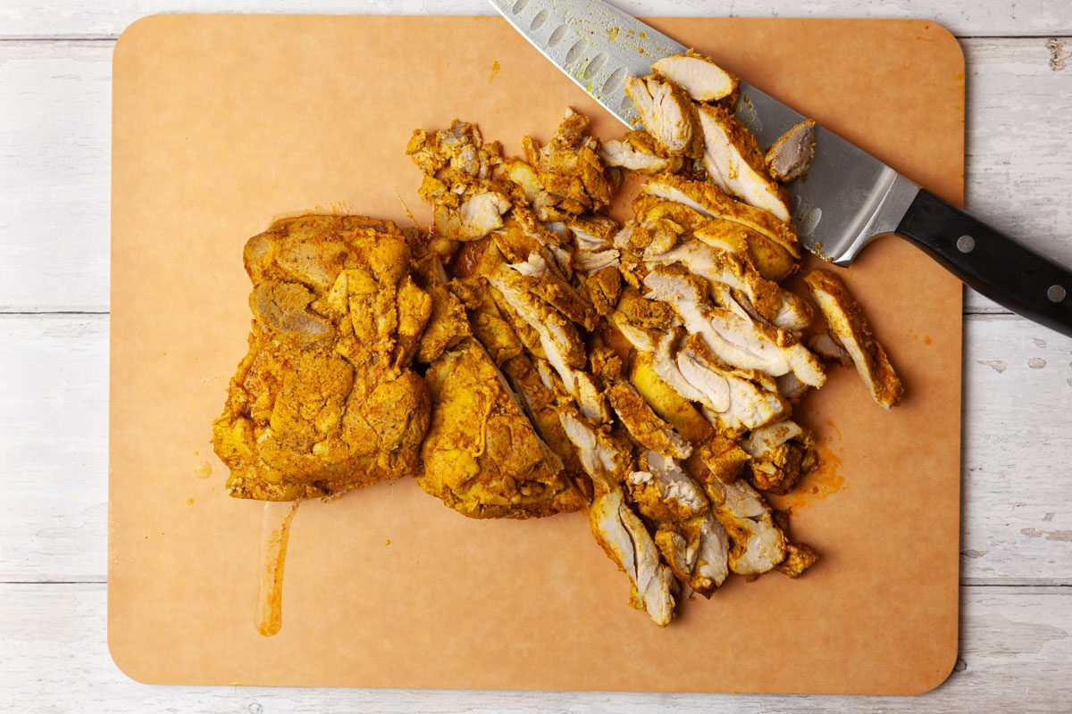 Step 4 of Taste of Home Chicken Shawarma is to slice the chicken