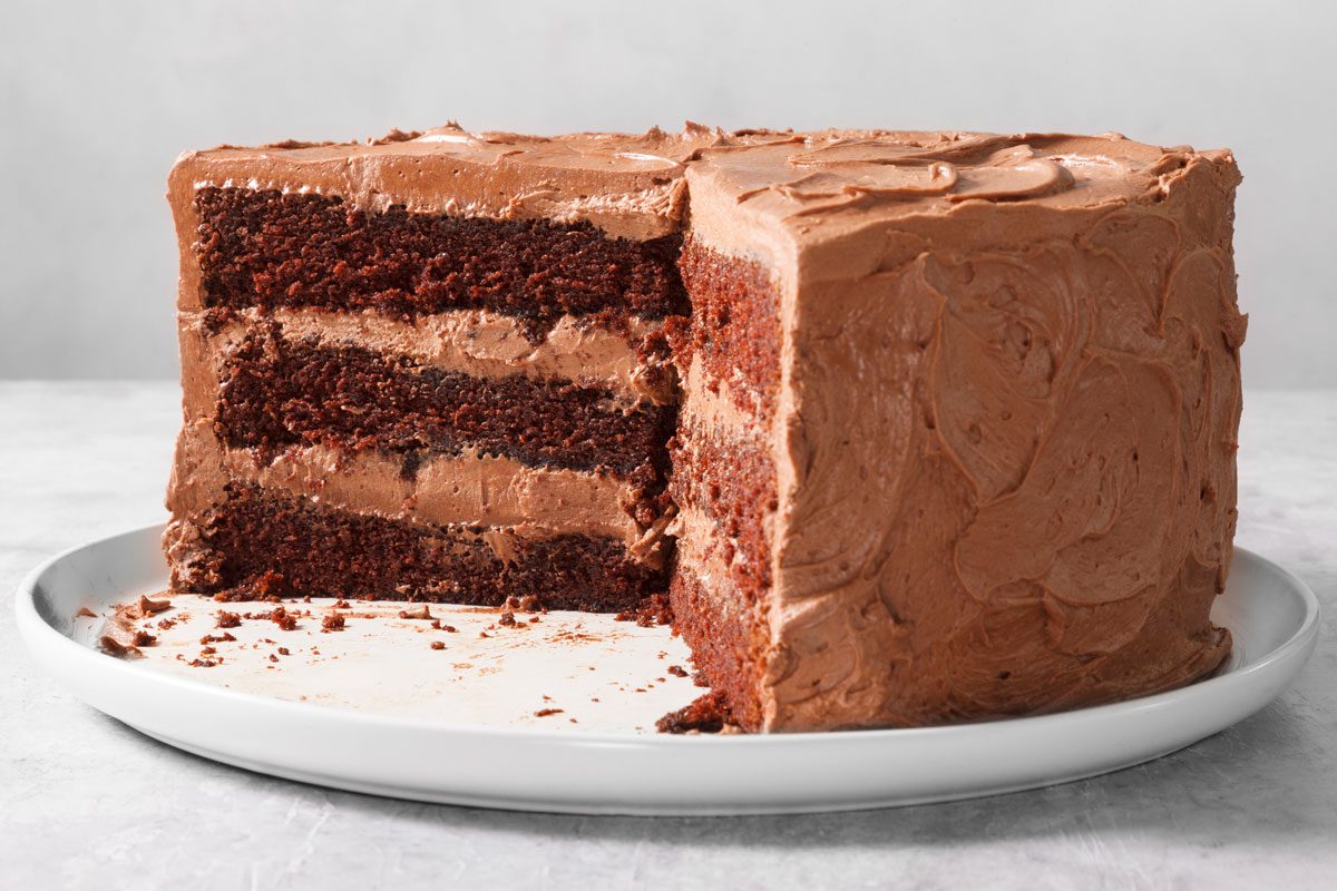 side view of a Chocolate Cake with some slices having been removed