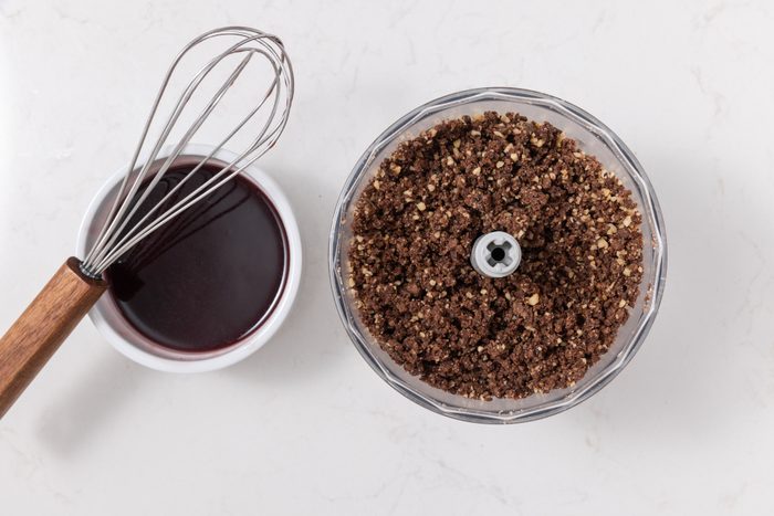 Chocolate rugelach filling being processed and raspberry jam warmed up.