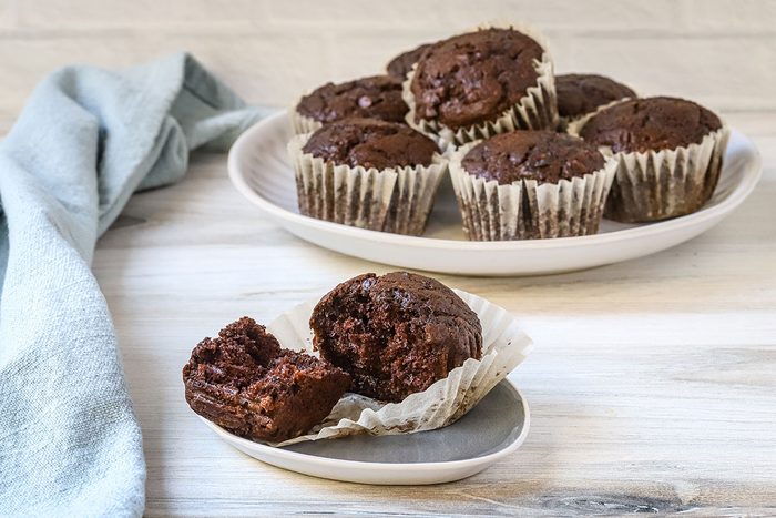 A split moist chocolate zucchini muffin, ready to enjoy.