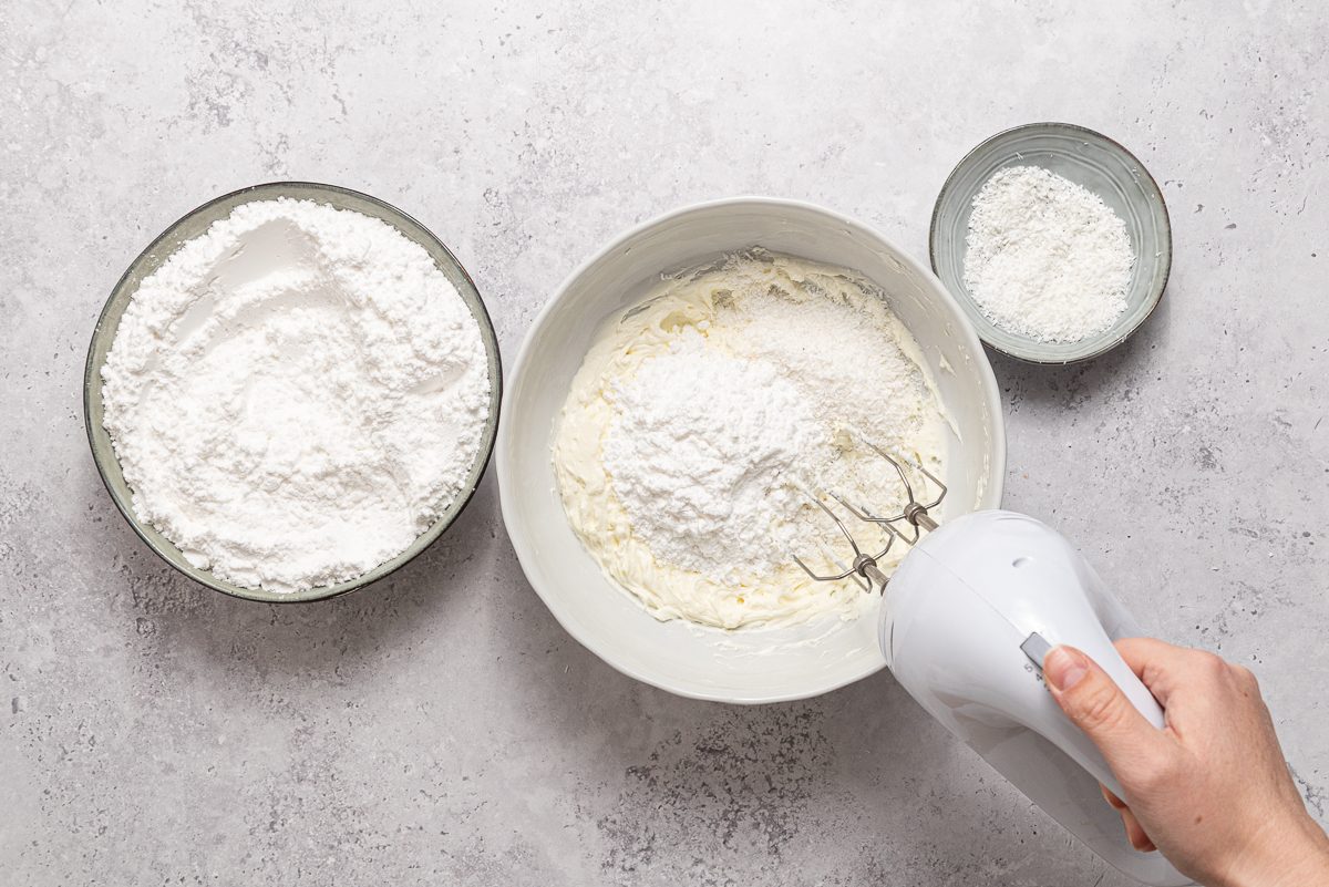 Bowls With Icing Sugar, Cream Cheese And Coconut Flour