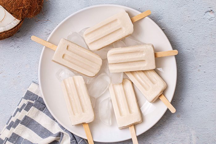 Overhead shot of Coconut Popsicles on a plate for Taste of Home