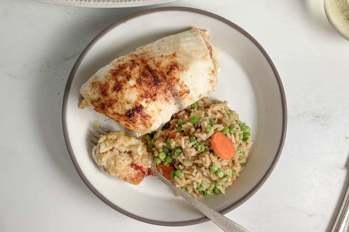 Taste of Home Crab Stuffed Tilapia on a ceramic plate with rice