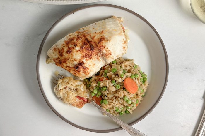 Taste of Home Crab Stuffed Tilapia on a ceramic plate with rice