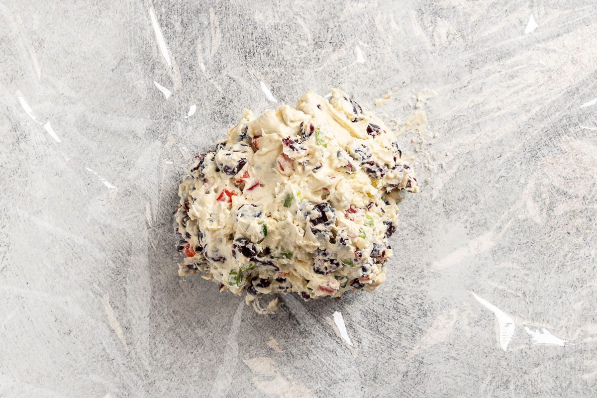 shaping the ball in plastic wrap.