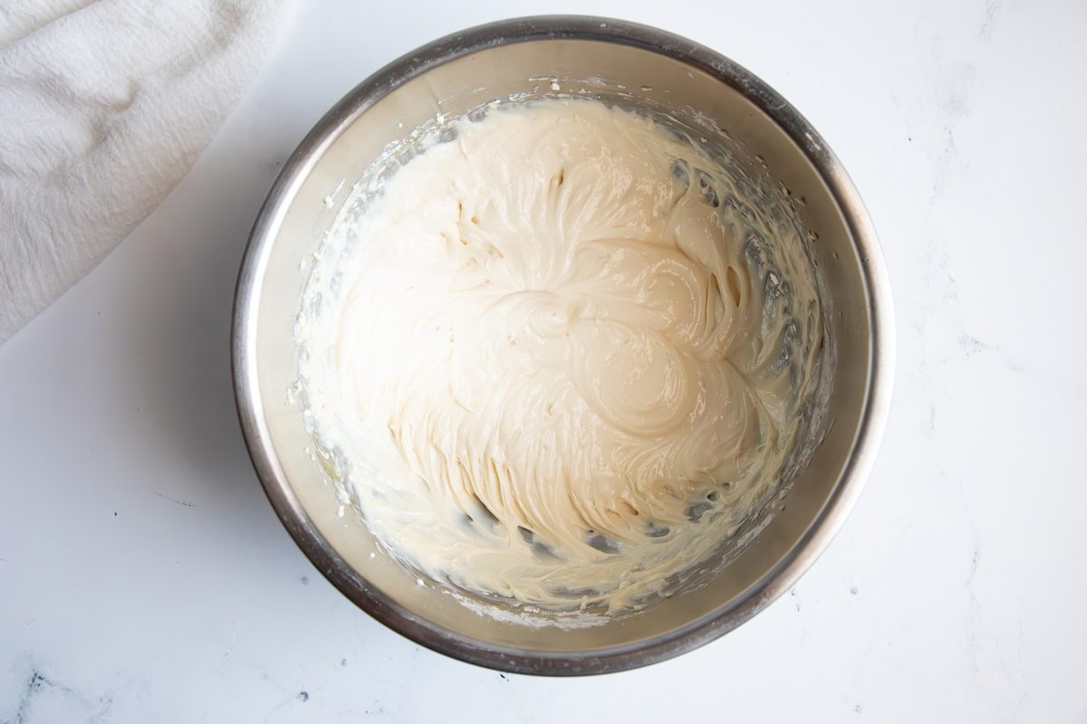Overhead shot for Taste of Crescent Rolls with Cherry Pie Filling, cream cheese mixture in a large bowl.