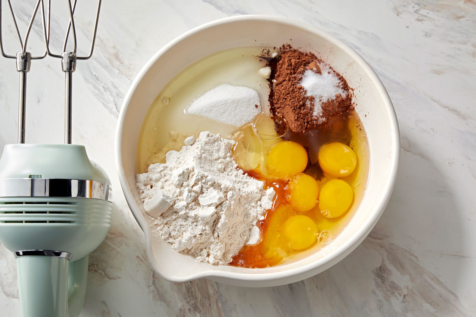 In a large bowl; beat the sugar, all-purpose flour, baking cocoa, salt, eggs, canola oil and vanilla extract