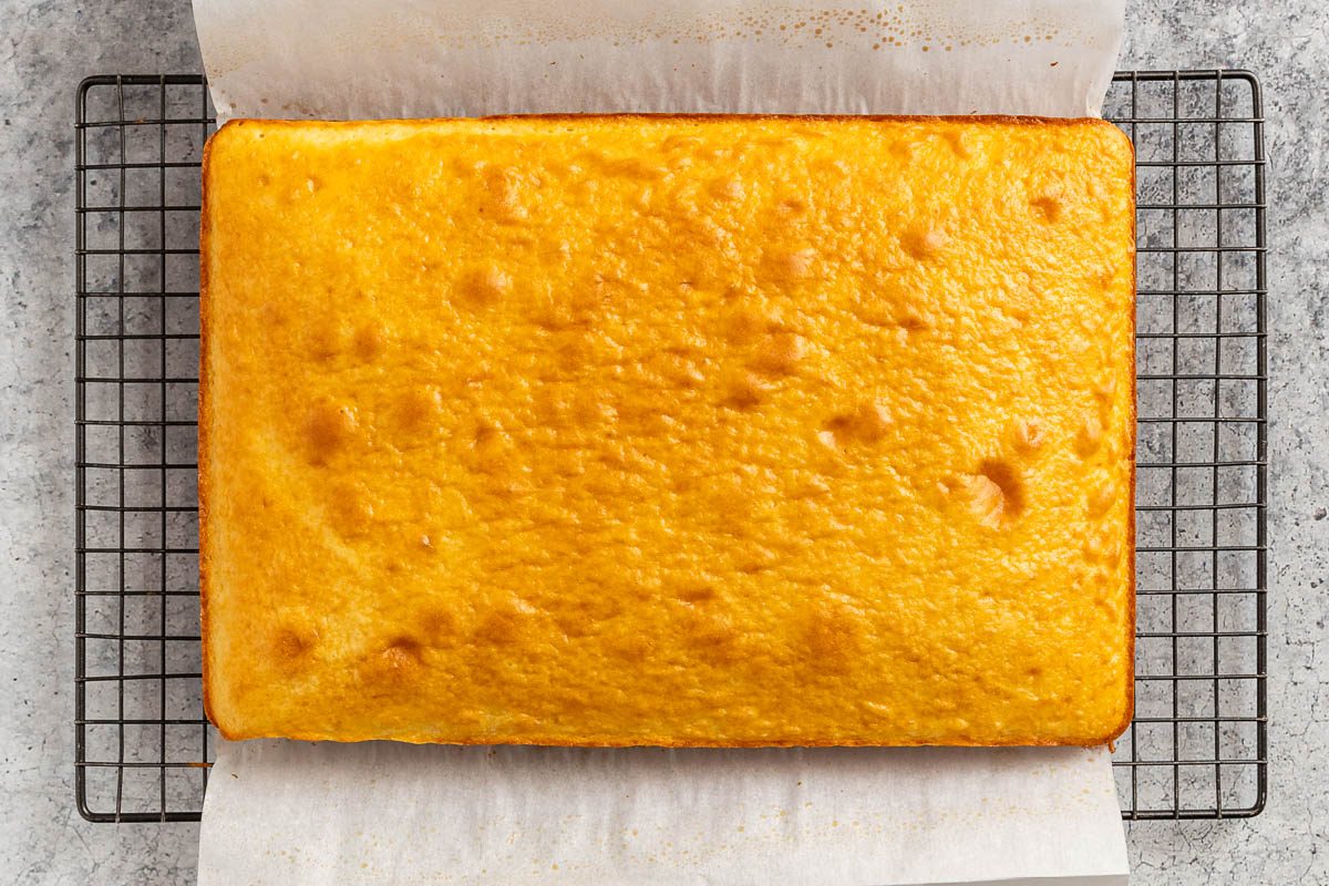 the baked cake cooling on a wire rack.