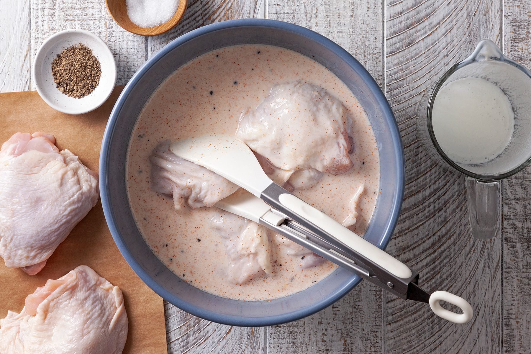 Place chicken thighs in bowl; toss to cover.