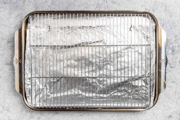 Taste of Home Gluten Free Meatballs recipe photo of preparing the sheet pan and rack.