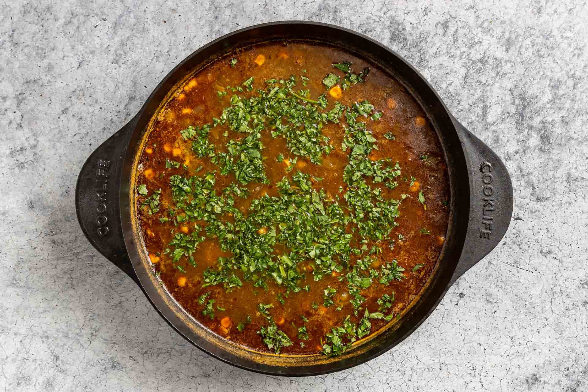 Taste of Home Green Chili Chicken Soup photo of all the ingredients simmered together and topped with fresh cilantro.