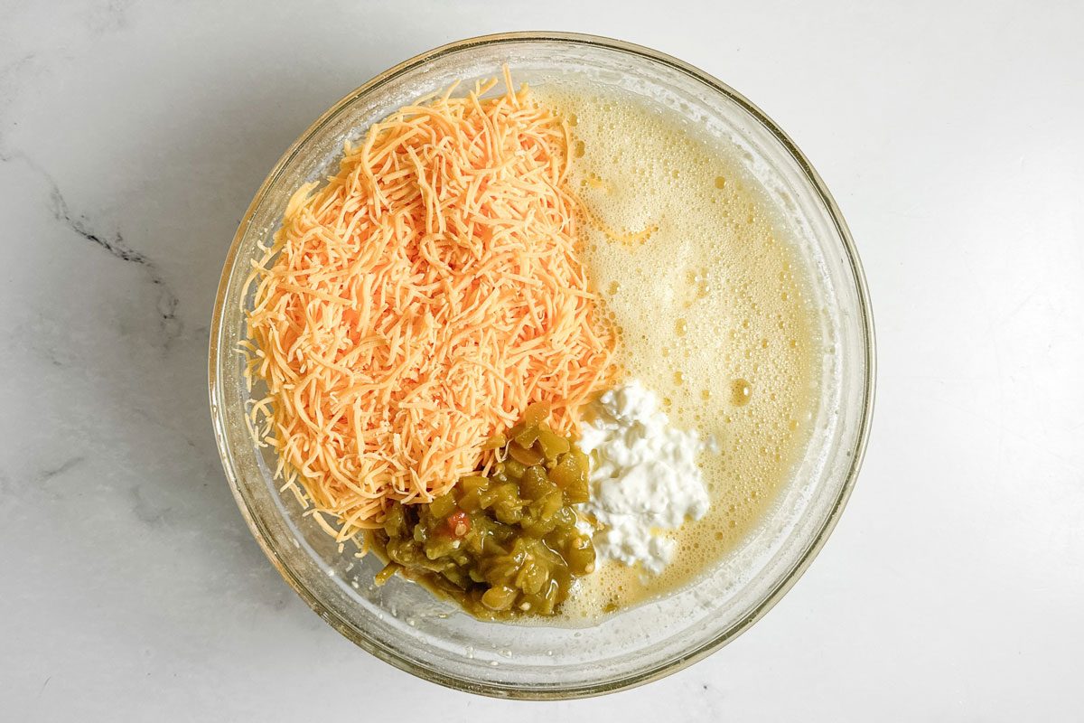 Ingredients for Taste of Home Green Chile Egg Casserole in a glass bowl