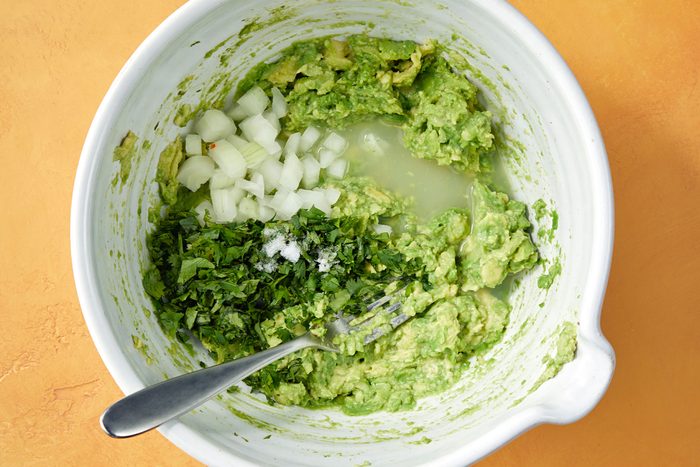 Mashed avocados with onion, cilantro, lime juice and salt.