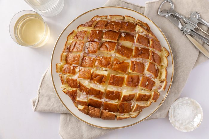 Hawaiian cheese bread baked and served on plate.