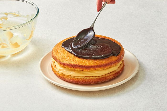 Assembling the Boston cream pie