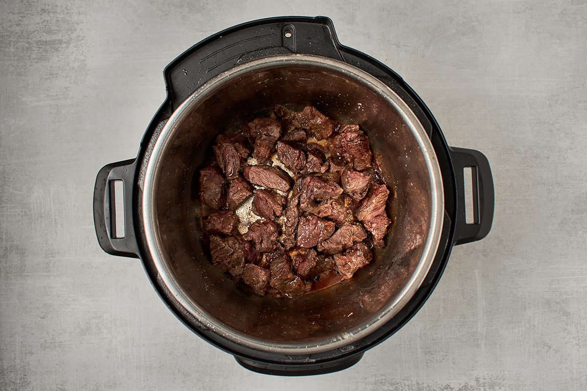 Season and sear beef