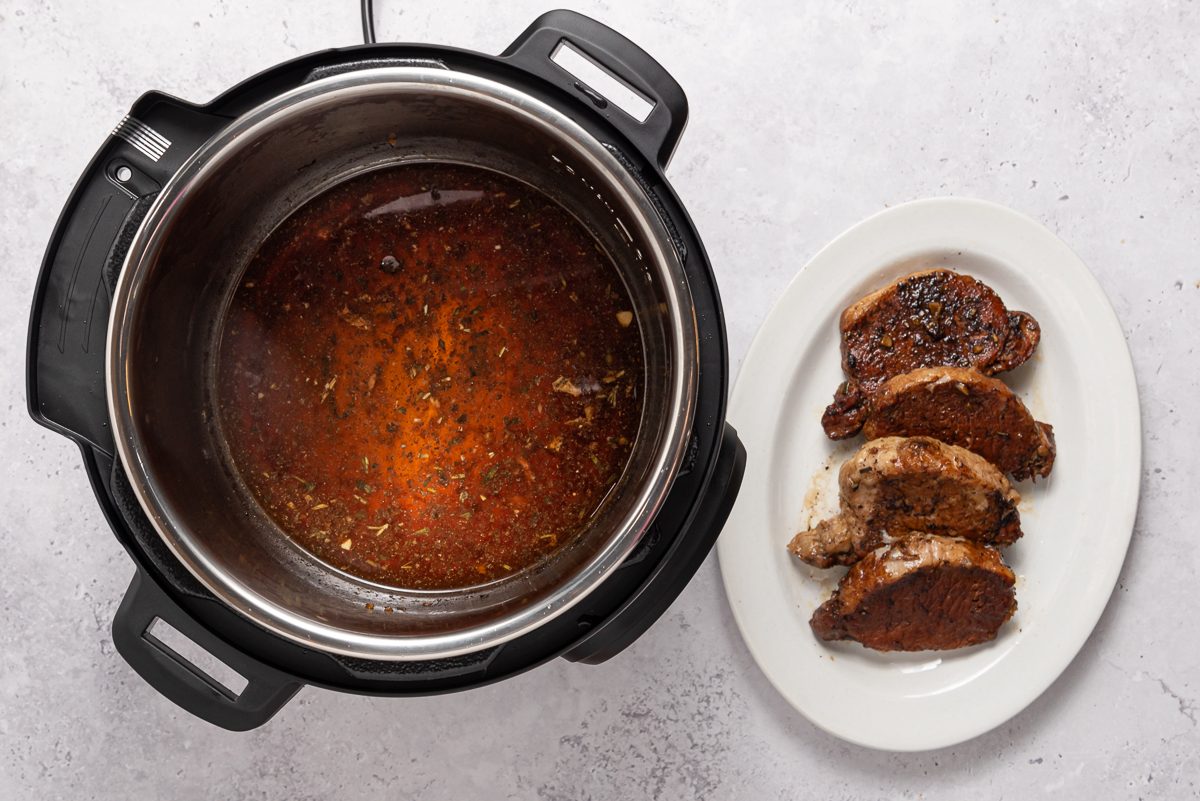 Instant Pot And Cooked Tenderloin On Serving Plate