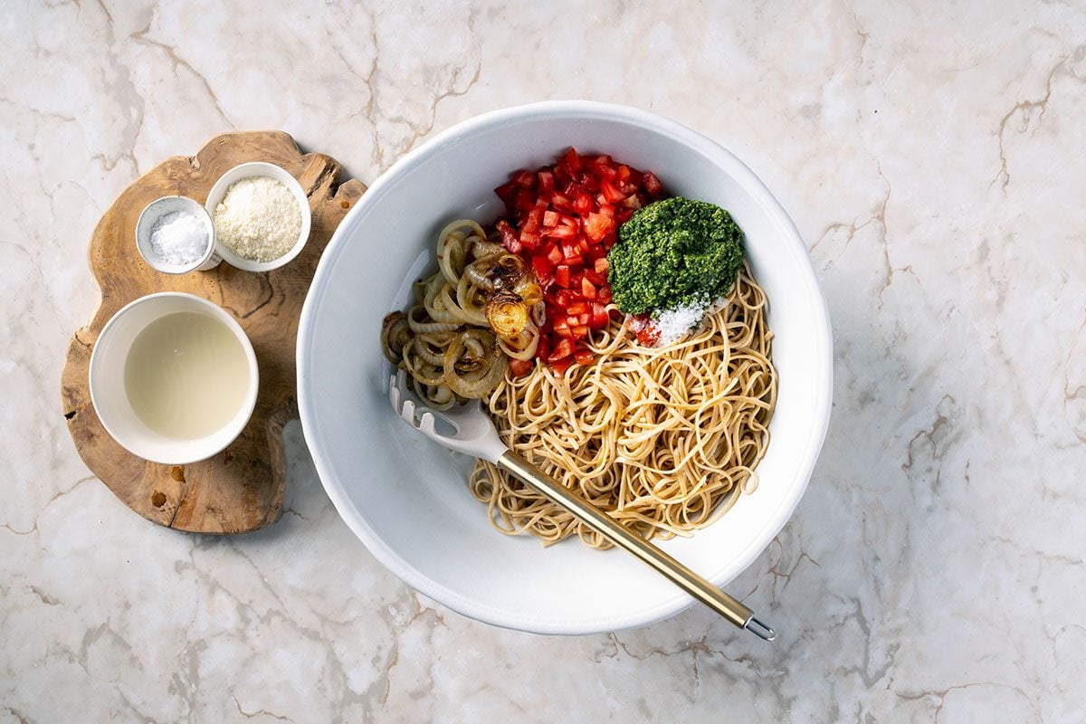 combing ingredients to make the kale pesto pasta dish