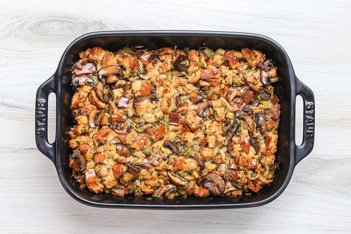 Baked keto stuffing made with low carb keto bread, mushrooms, celery, onions, garlic, sate, butter, and parsley.