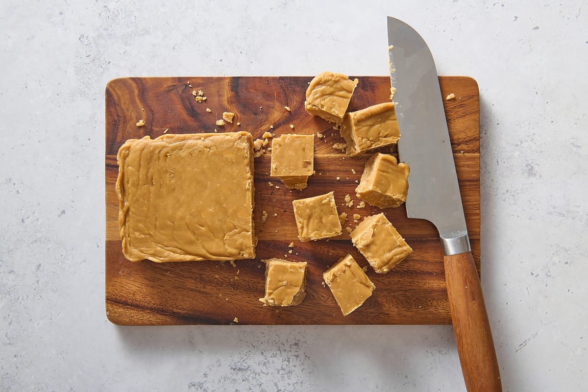 Maple fudge being cut into squares