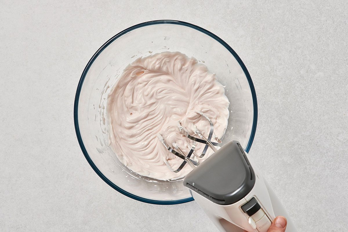 Cream cheese and yogurt blended well in a bowl