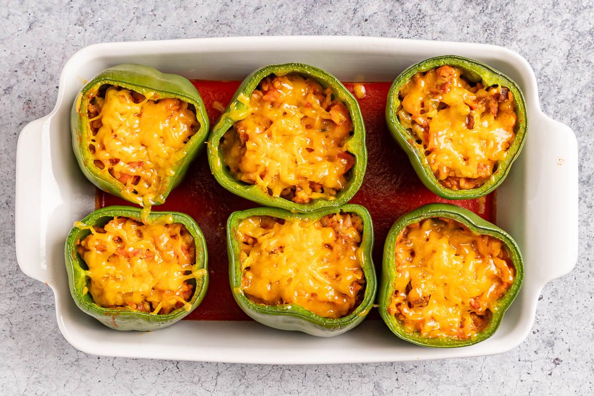 Taste of Home Meatloaf Stuffed Peppers photo of the baked peppers topped with cheese.