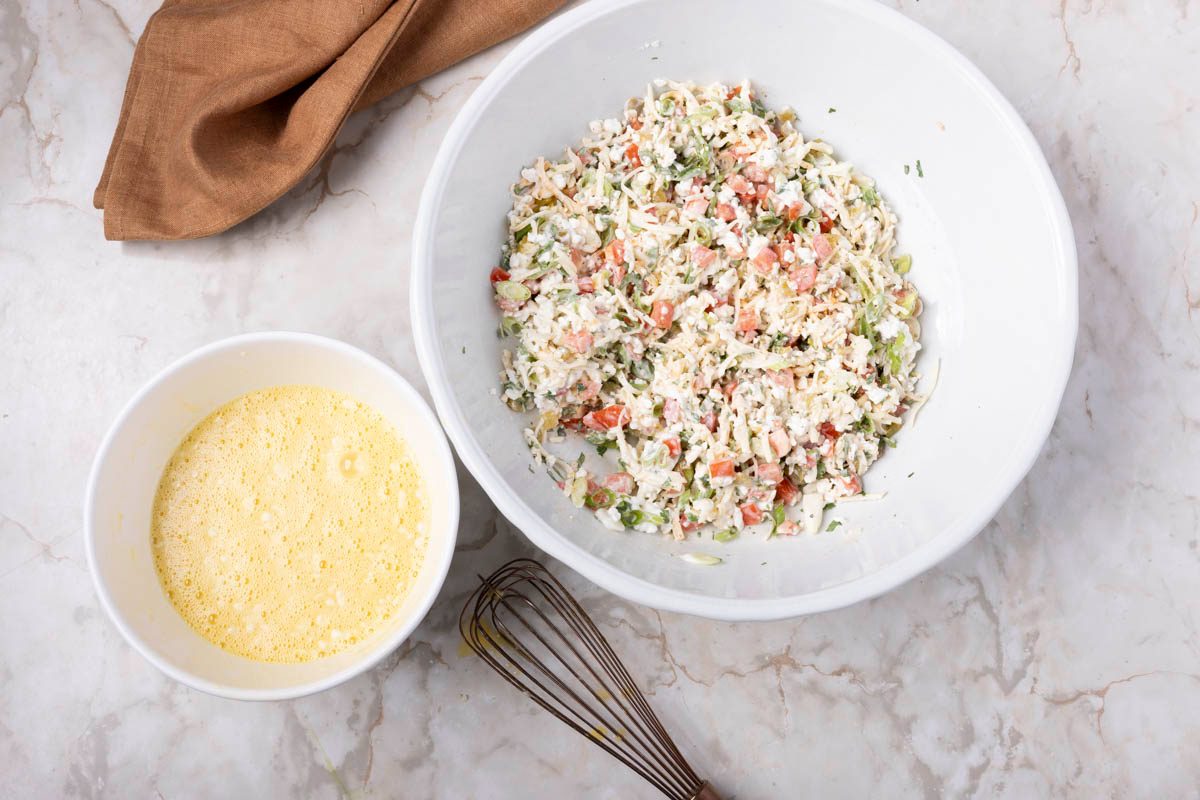 Mexican Breakfast Casserole being made before baking in two large bowls