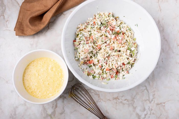 Mexican Breakfast Casserole being made before baking in two large bowls