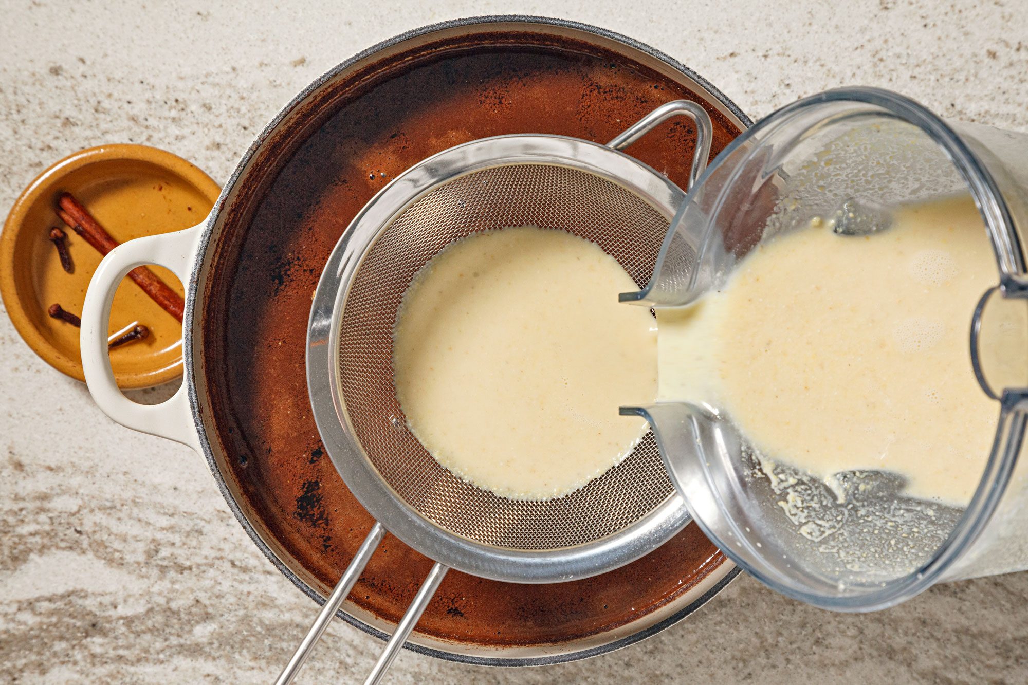 Pour masa mixture through a fine mesh strainer into the chocolate mixture.