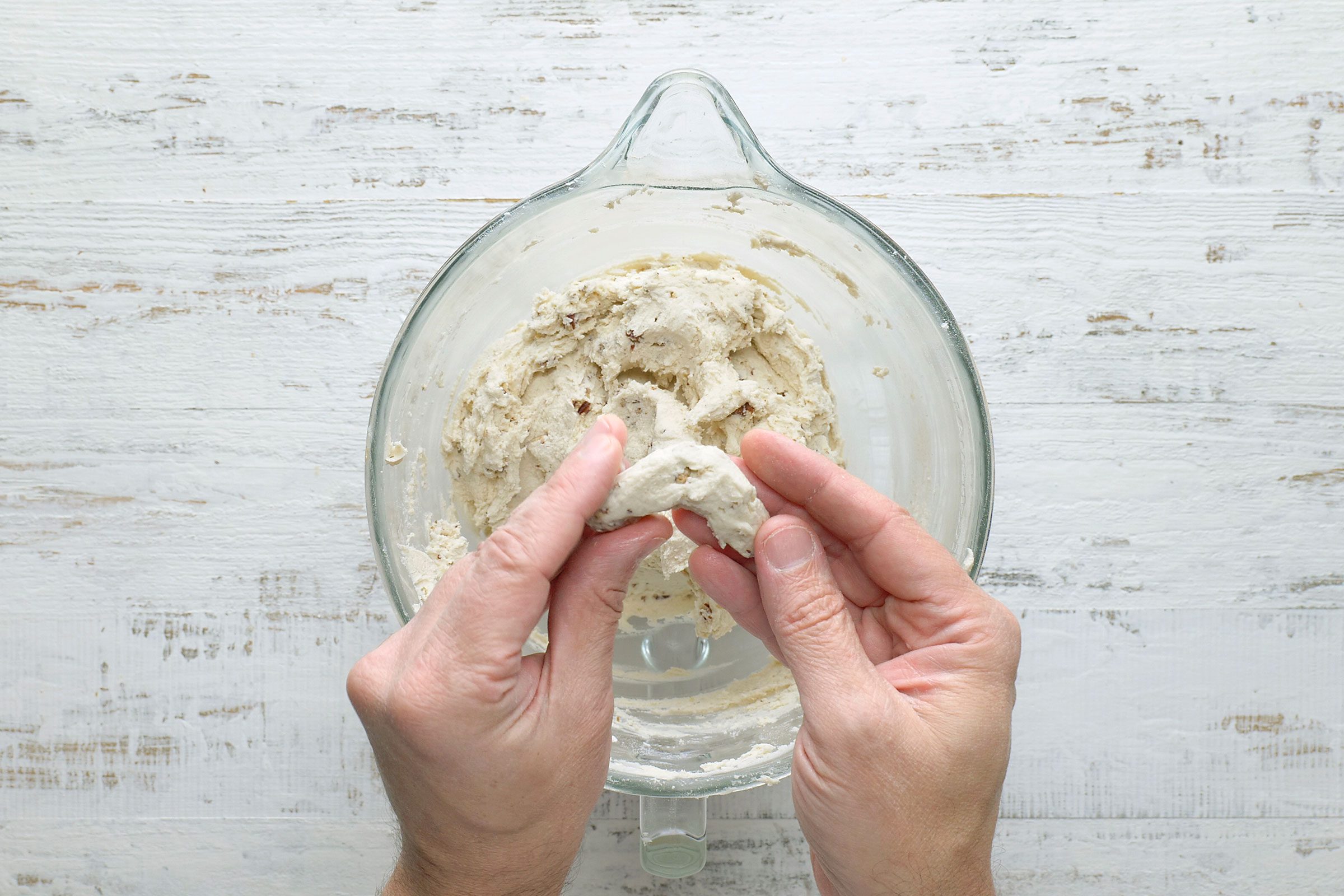 Shaping dough into crescent shape