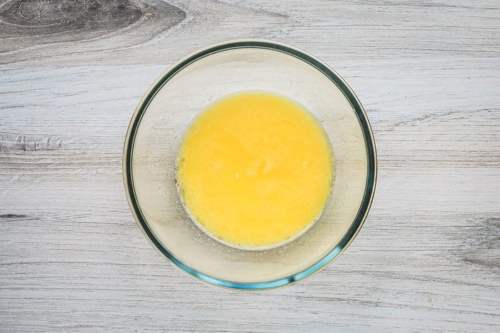 Heated milk and butter for microwave mashed potatoes, a side dish from Taste of Home.