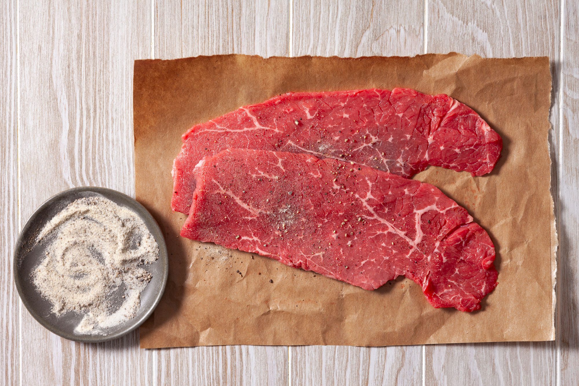 Sprinkle half of the seasoning mixture on each sides of steaks