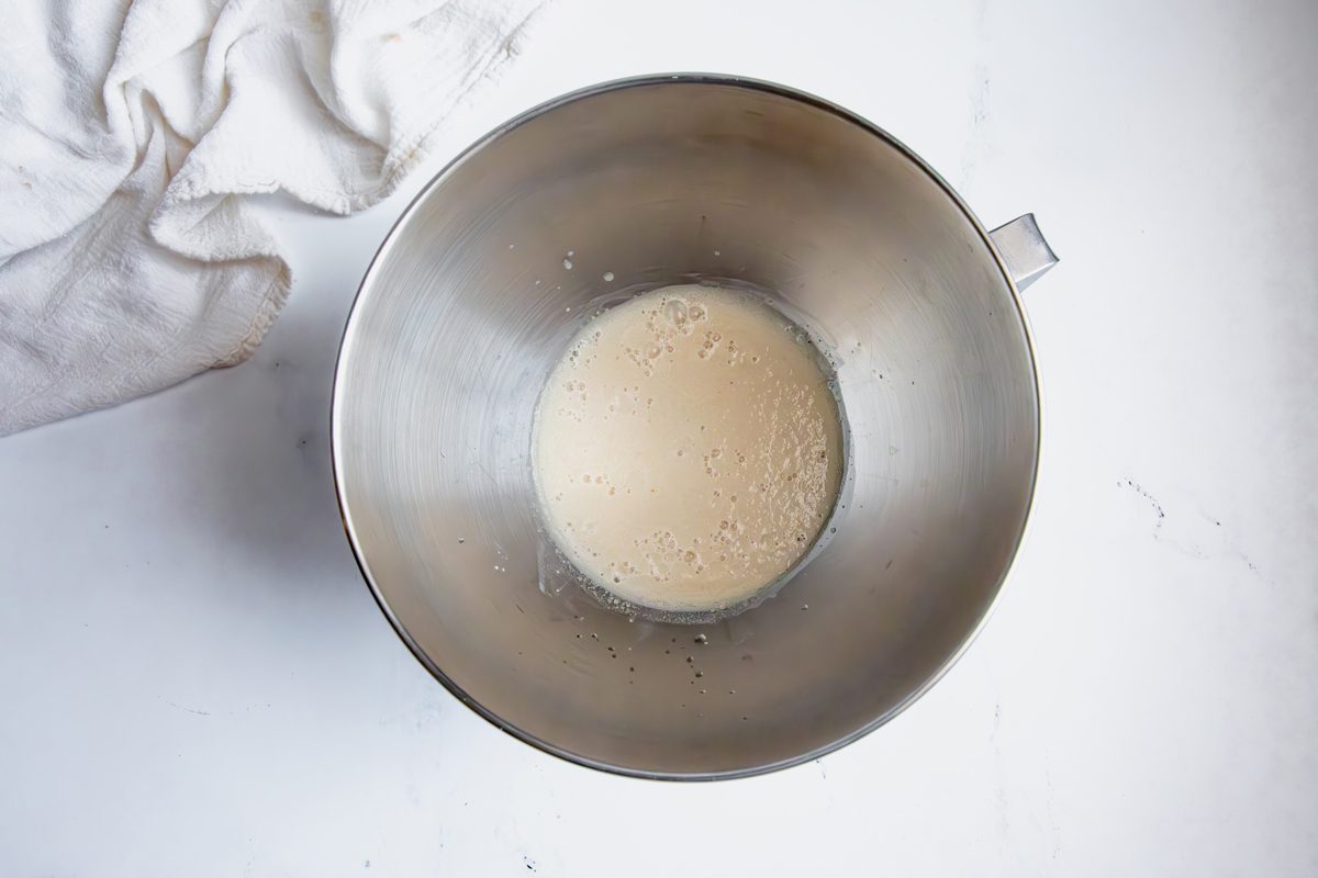 Oberhead shot for Taste of Home Mini Bread Loaf, yeast mixture bubbling in a large mixing bowl.