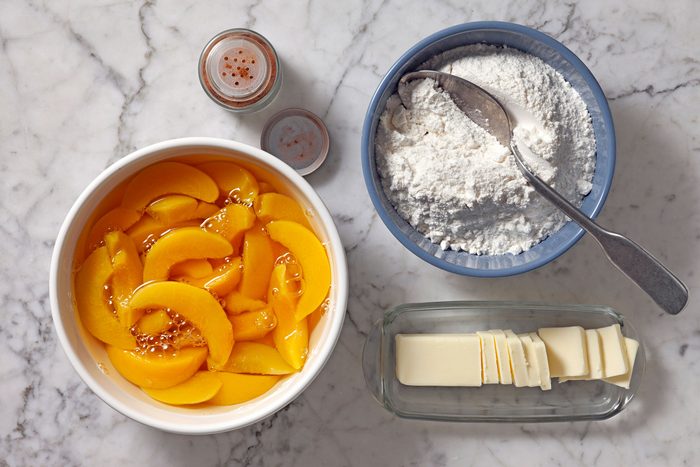 Butter, cinnamon, peaches and cake mix.