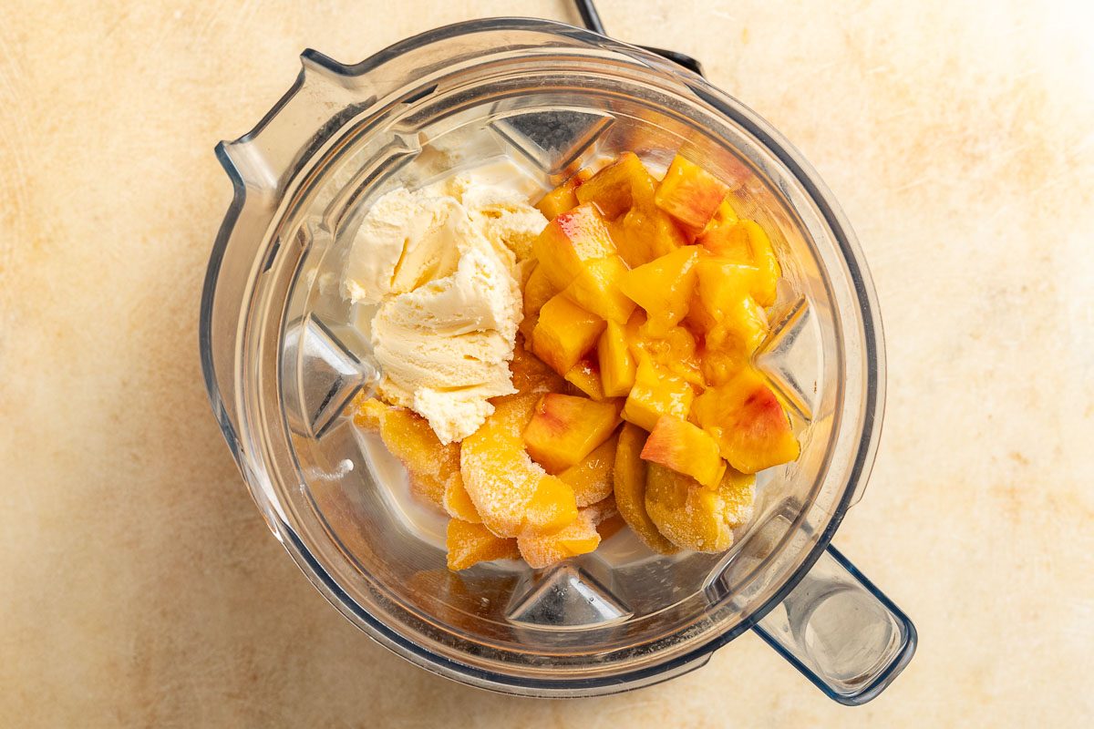 Taste of Home Peach Milkshake photo of the ingredients in a blender.