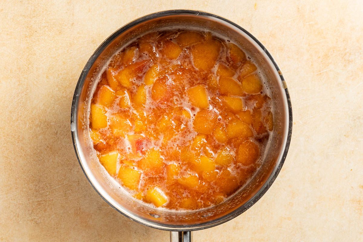 Taste of Home Peach Syrup photo of cooking the peaches.