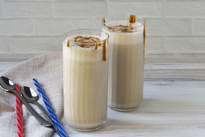 Two glasses of peanut butter banana smoothies, a recipe from Taste of Home.