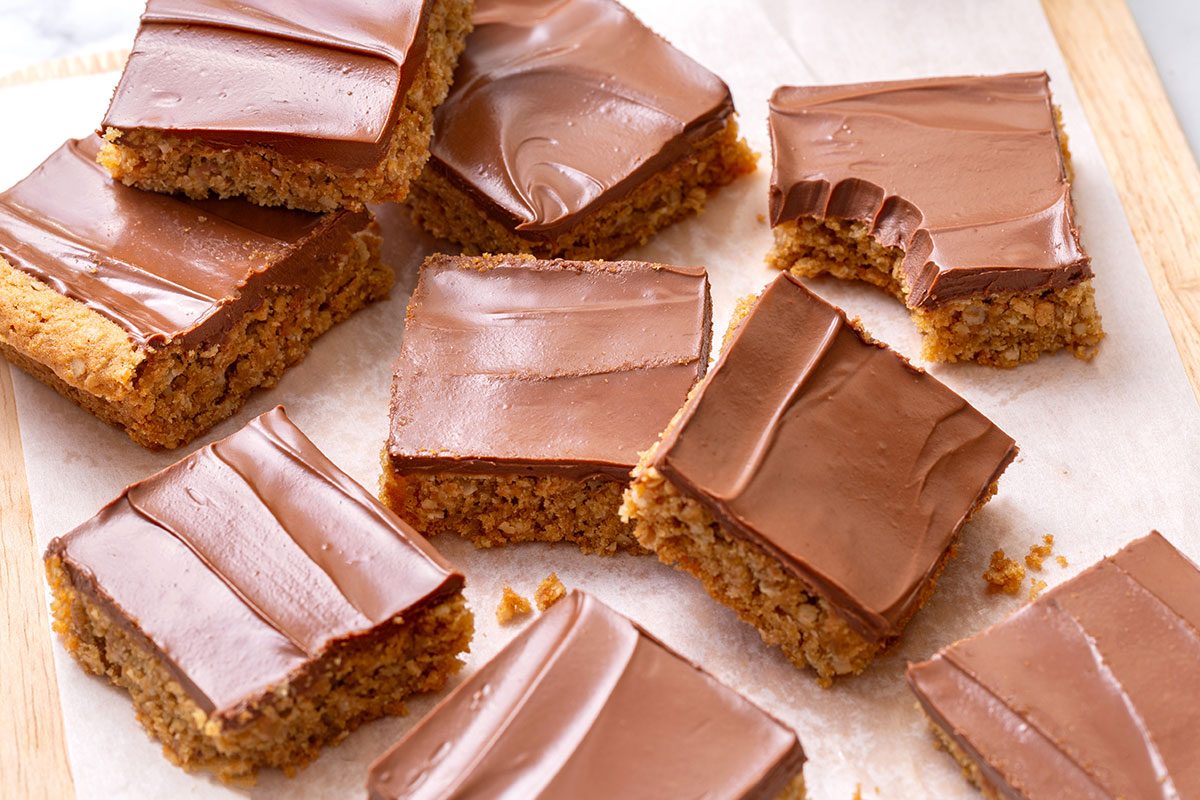 Arrangement of cut out Peanut Butter Cookie Bars on a wooden cutting board for Taste of Home