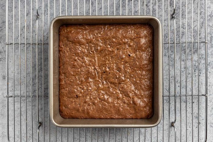baked brownies cooling on a rack.