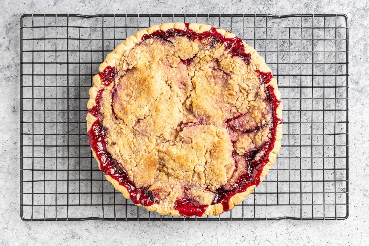 Taste of Home Plum Pie photo of the baked pie on a cooling rack.