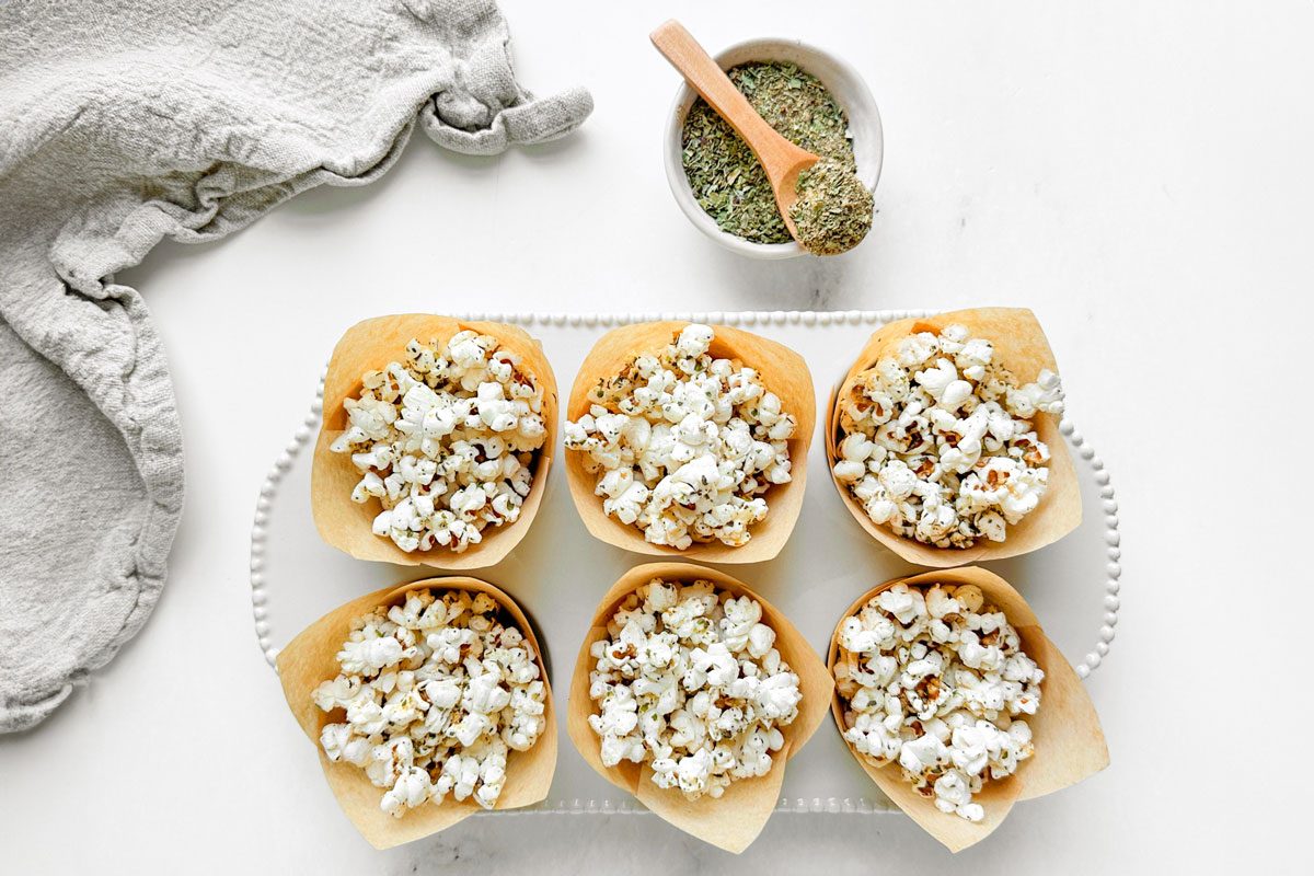 Popcorn with Taste of Home Popcorn Seasoning in parchment lined muffin cups