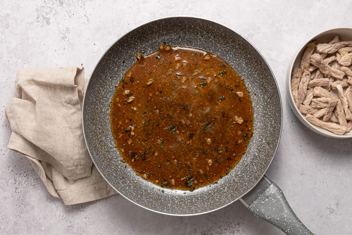 Sauce In Pan With Pork Strips