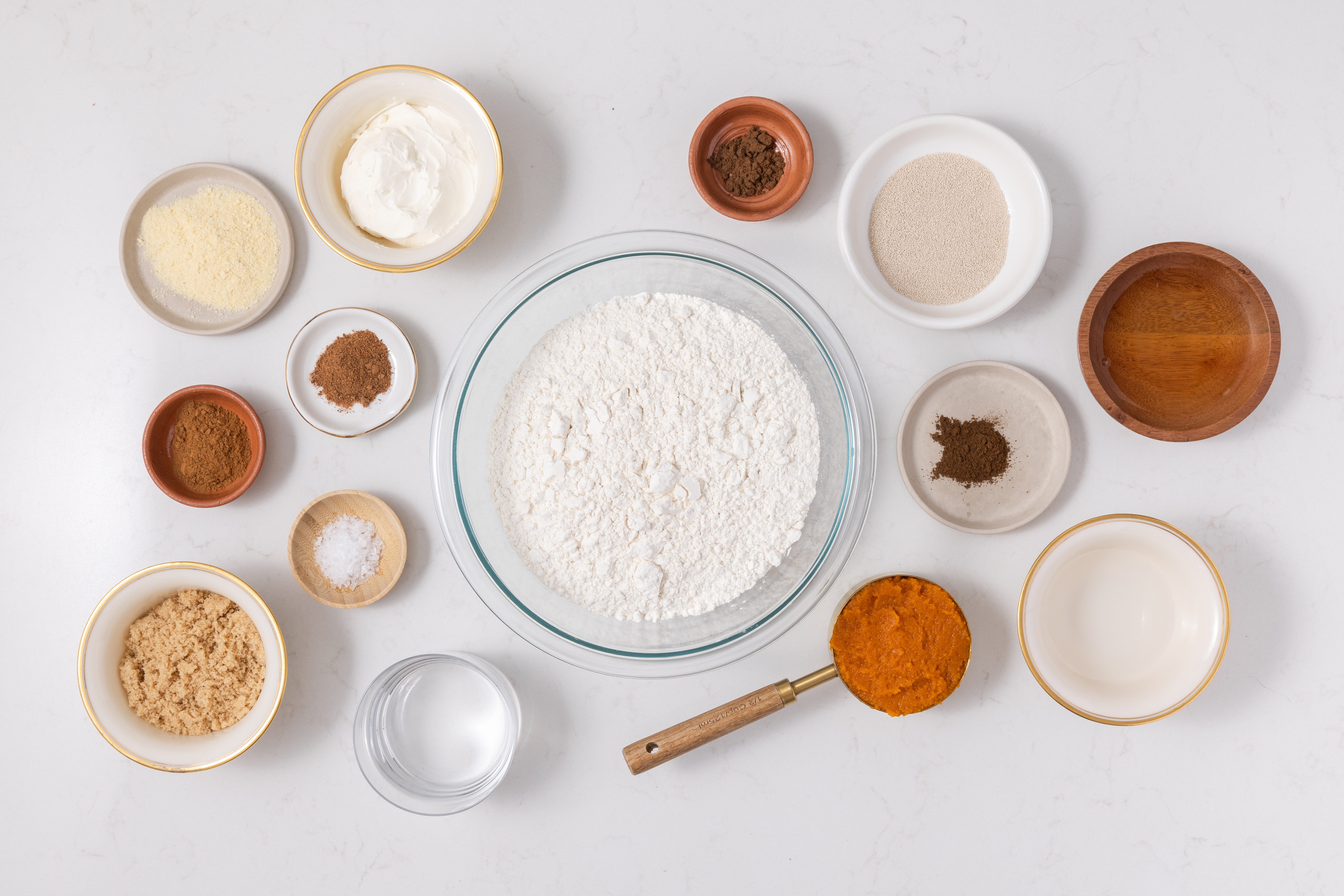 Ingredients for pumpkin bagels on kitchen counter.