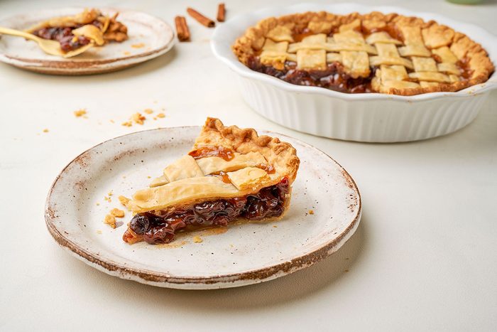 A close-up of Taste of Home's Raisin Pie, showcasing the detailed lattice crust and caramelized raisins peeking through.