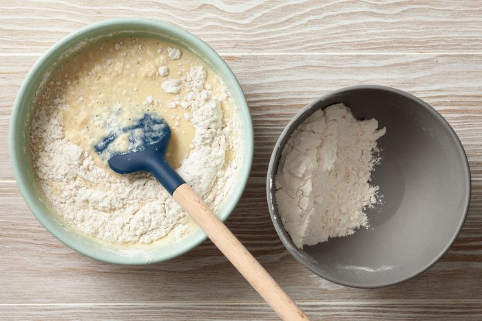 Eggs, milk, sugar and vanilla extract mixture added to the flour and salt mixture.