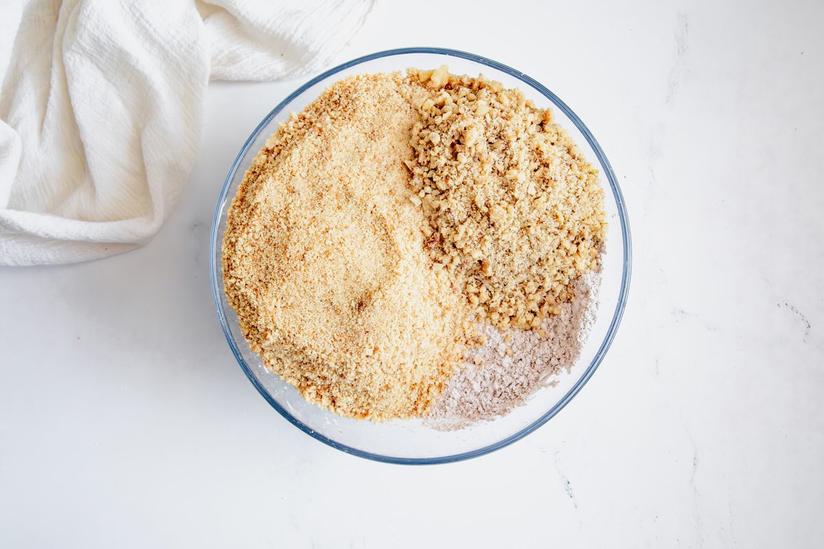 Overhead shot for Taste of Home Rum Balls, with dry ingredients in a glass bowl.