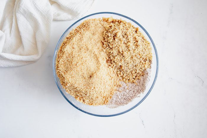 Overhead shot for Taste of Home Rum Balls, with dry ingredients in a glass bowl.