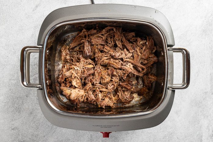 Shredded Beef in slow cooker before sauce