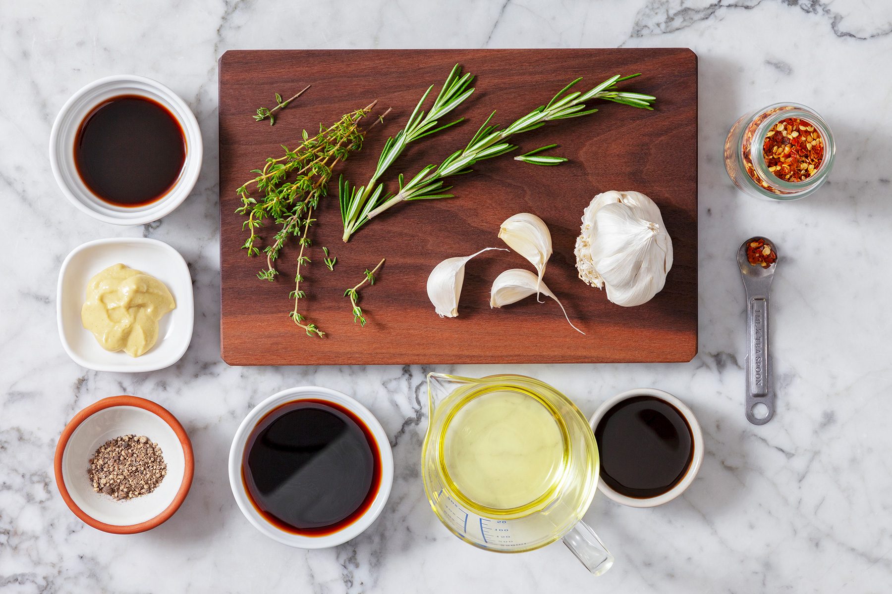 overhead shot of Steak Marinade ingredients placed over wooden chopping board and background;