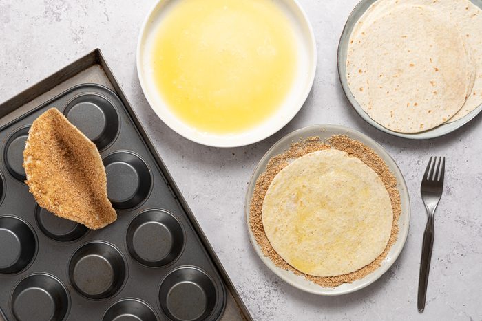 Bowls With Melted Butter, Graham Crackers And Tortillas